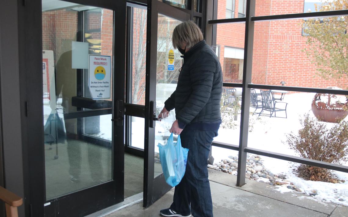 Dave Filipi, of Columbus, Ohio, enters Bethany Retirement Living on University Drive in Fargo to visit his father after more than a year. C.S. Hagen / The Forum